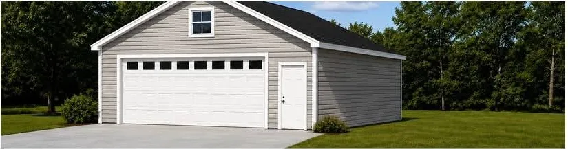 Finished 24-foot by 24-foot detached garage with vinyl siding, shingle roof, and a double overhead door
